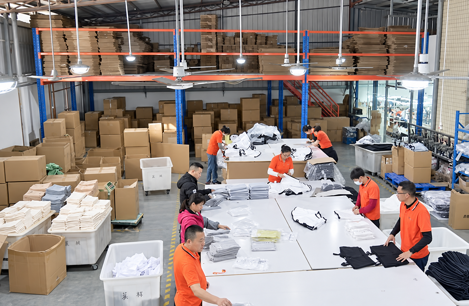 HUAJUN finishing and packing team working at long tables in the factory